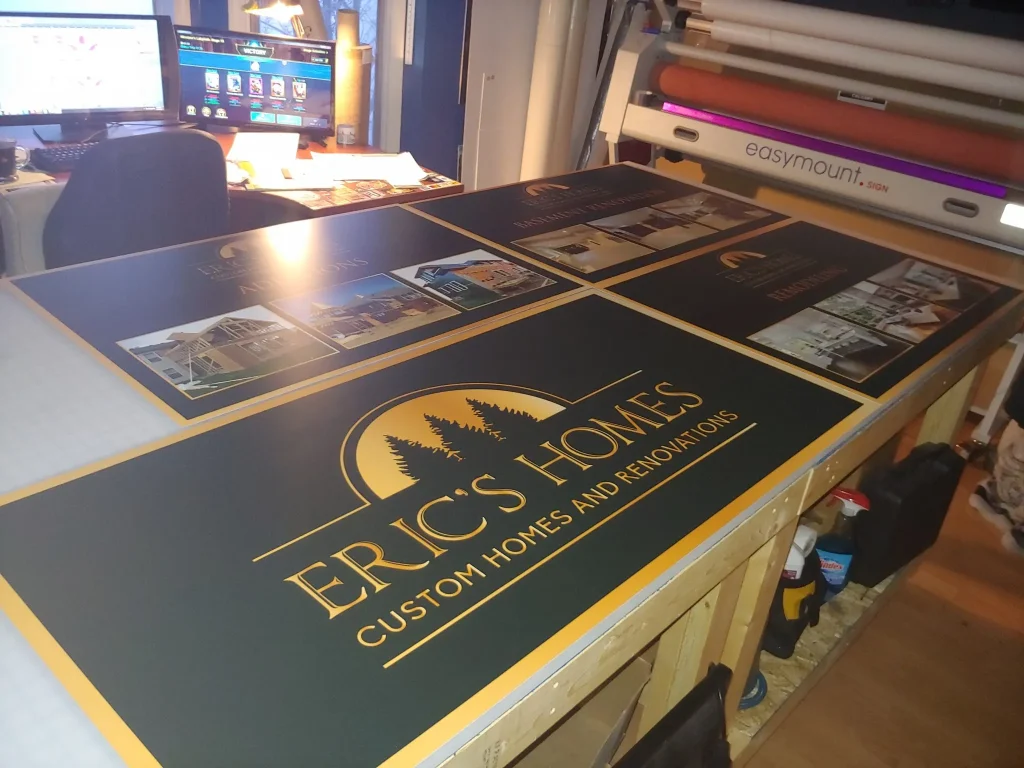 A colorful sign displays "Eric's Homes" alongside various images and text